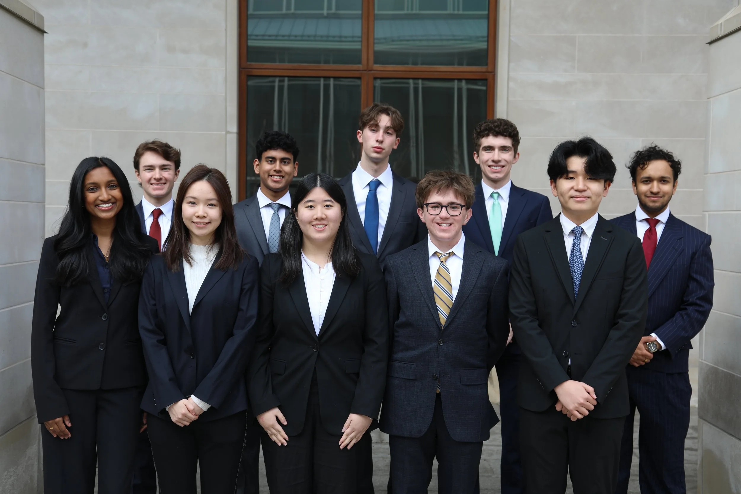 180 Degrees Consulting WashU members in business attire